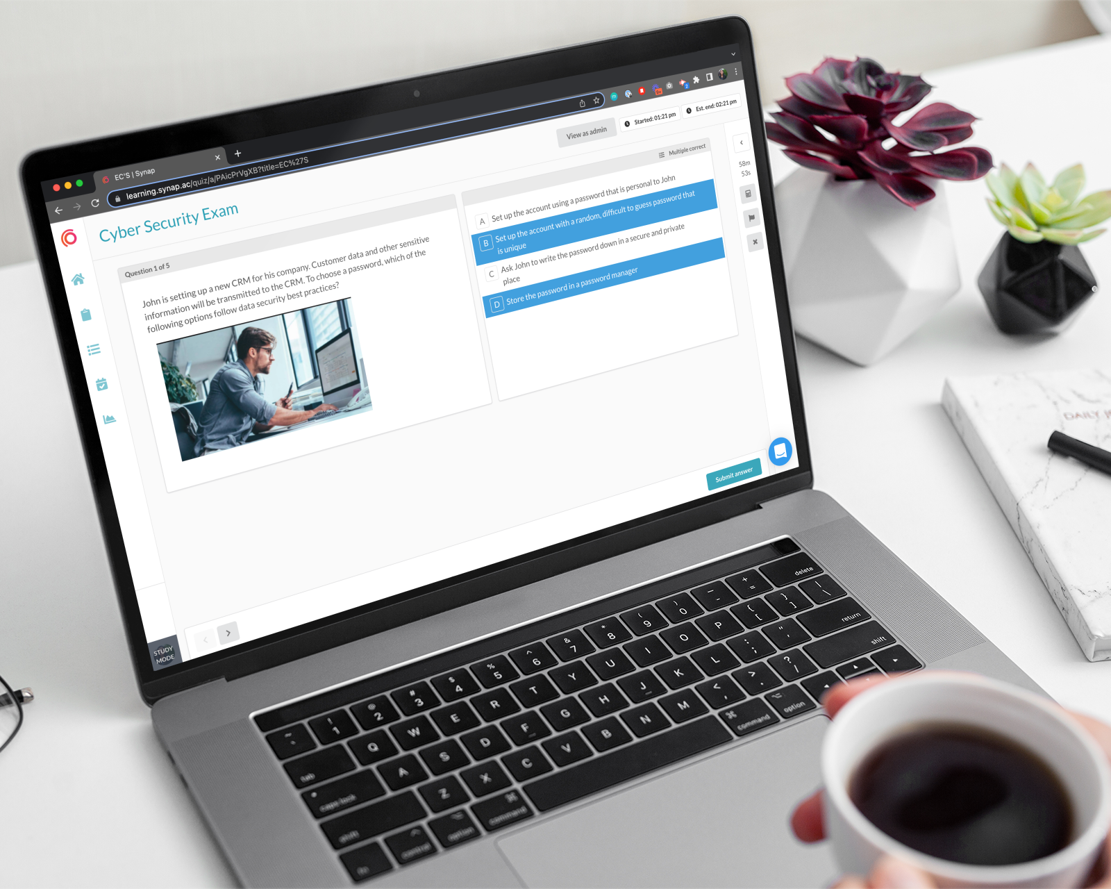 Person taking an exam on Synap platform using MacBook Pro while holding a coffee.