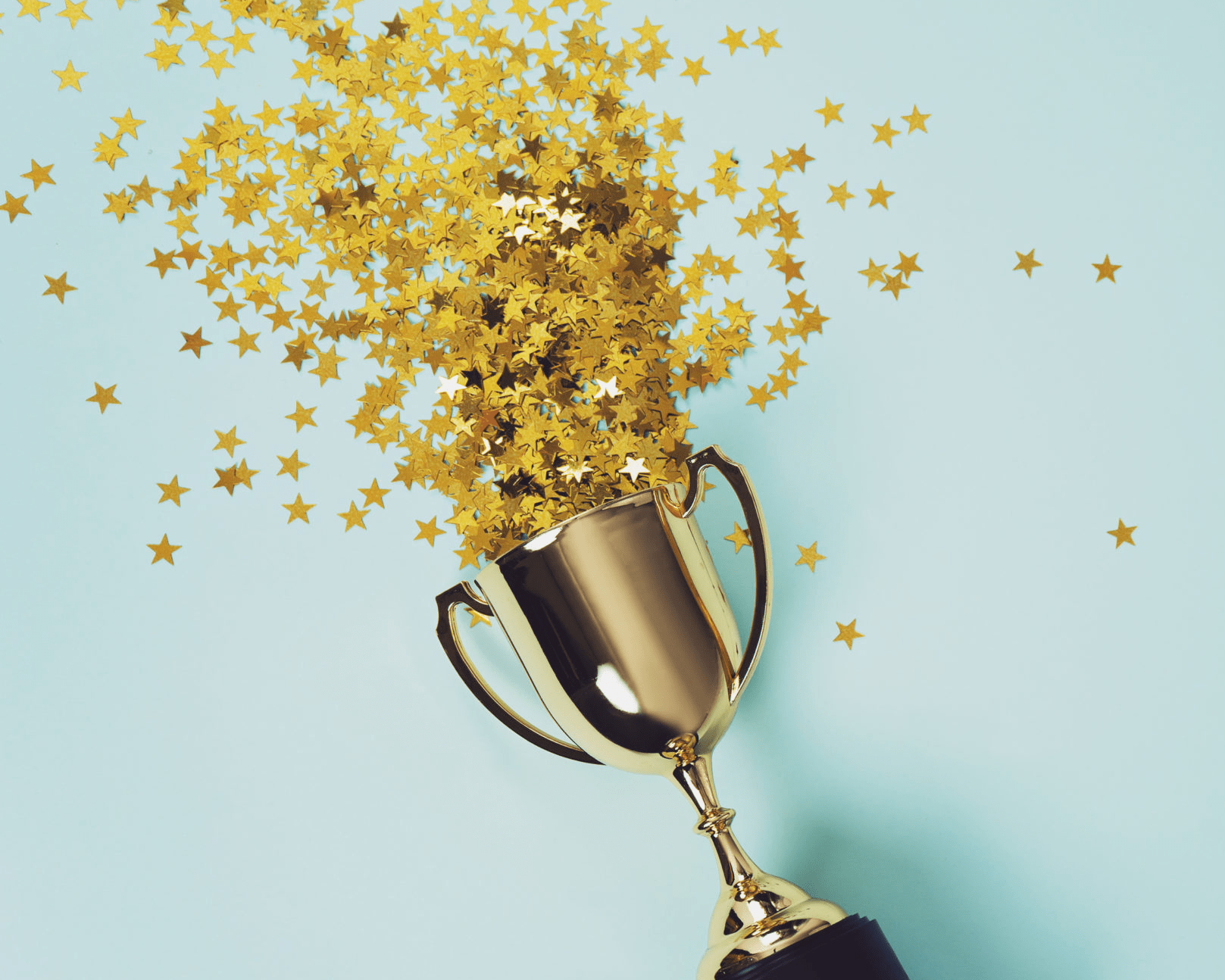 Trophy with stars falling out of the top