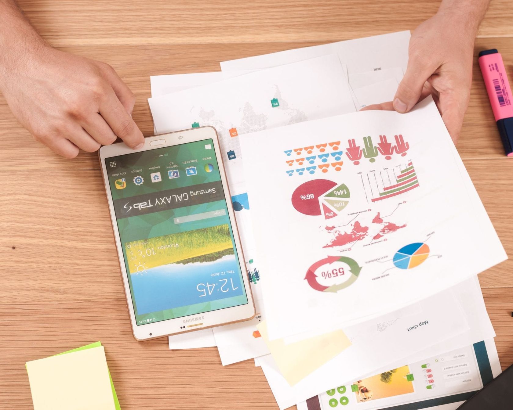 Paper with charts and a highlighter