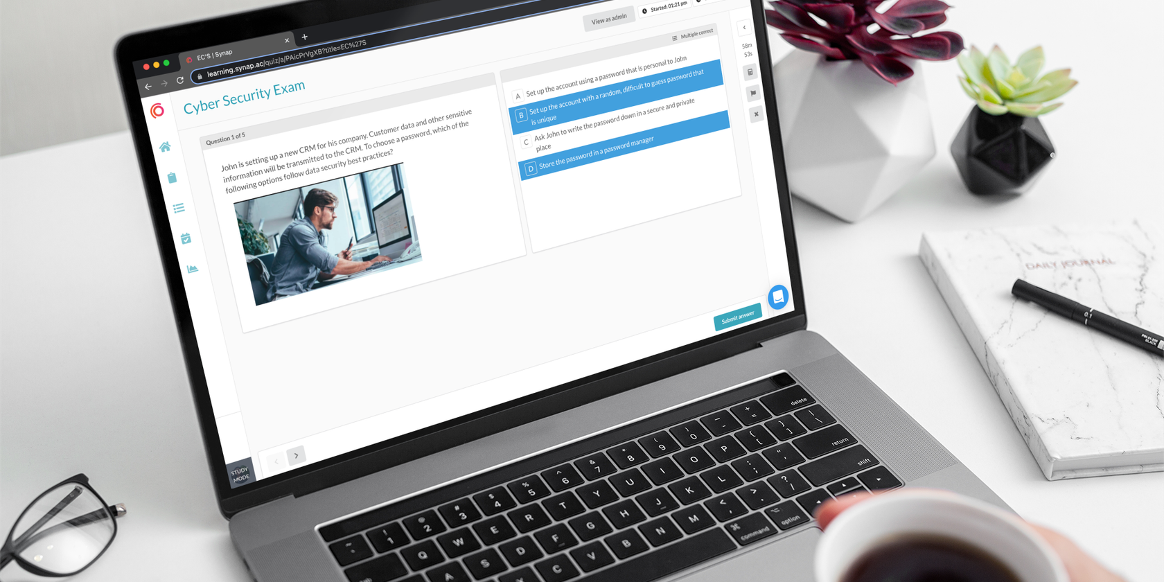 Person taking an exam on Synap platform using MacBook Pro while holding a coffee.