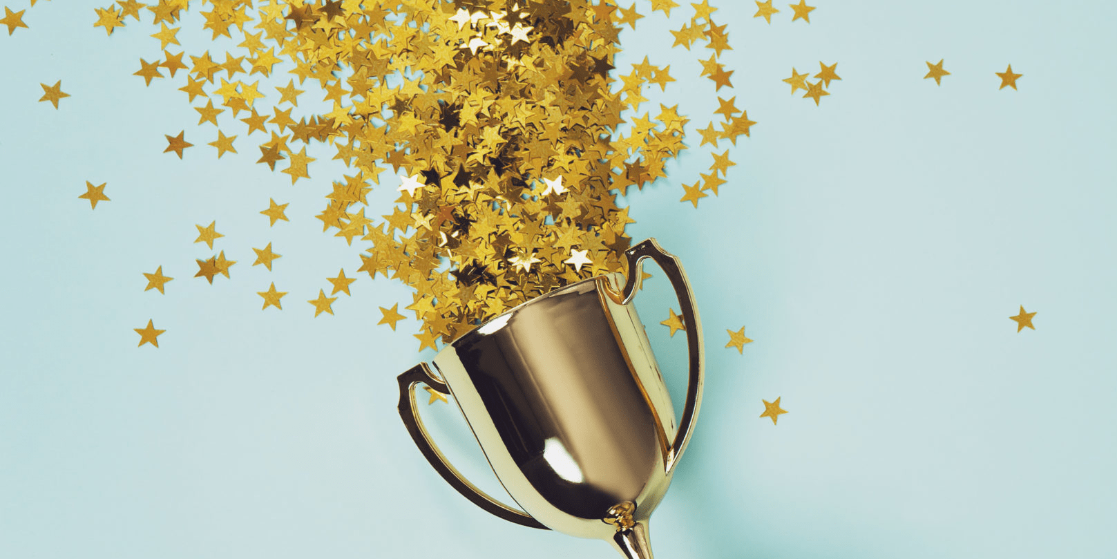 Trophy with stars falling out of the top