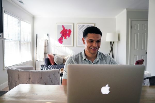 Candidate sitting a proctored online exam at home