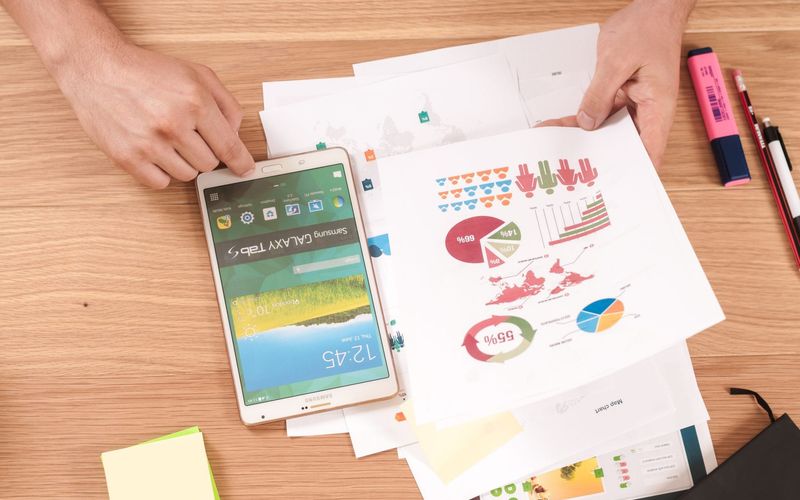 Paper with charts and a highlighter