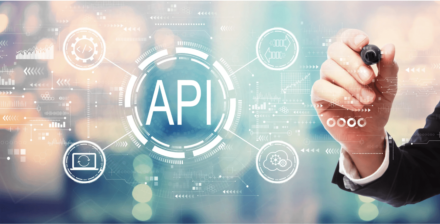 Hand drawing over a digital interface with the word API in the center, surrounded by icons representing cloud computing, data syncing, and system integration.