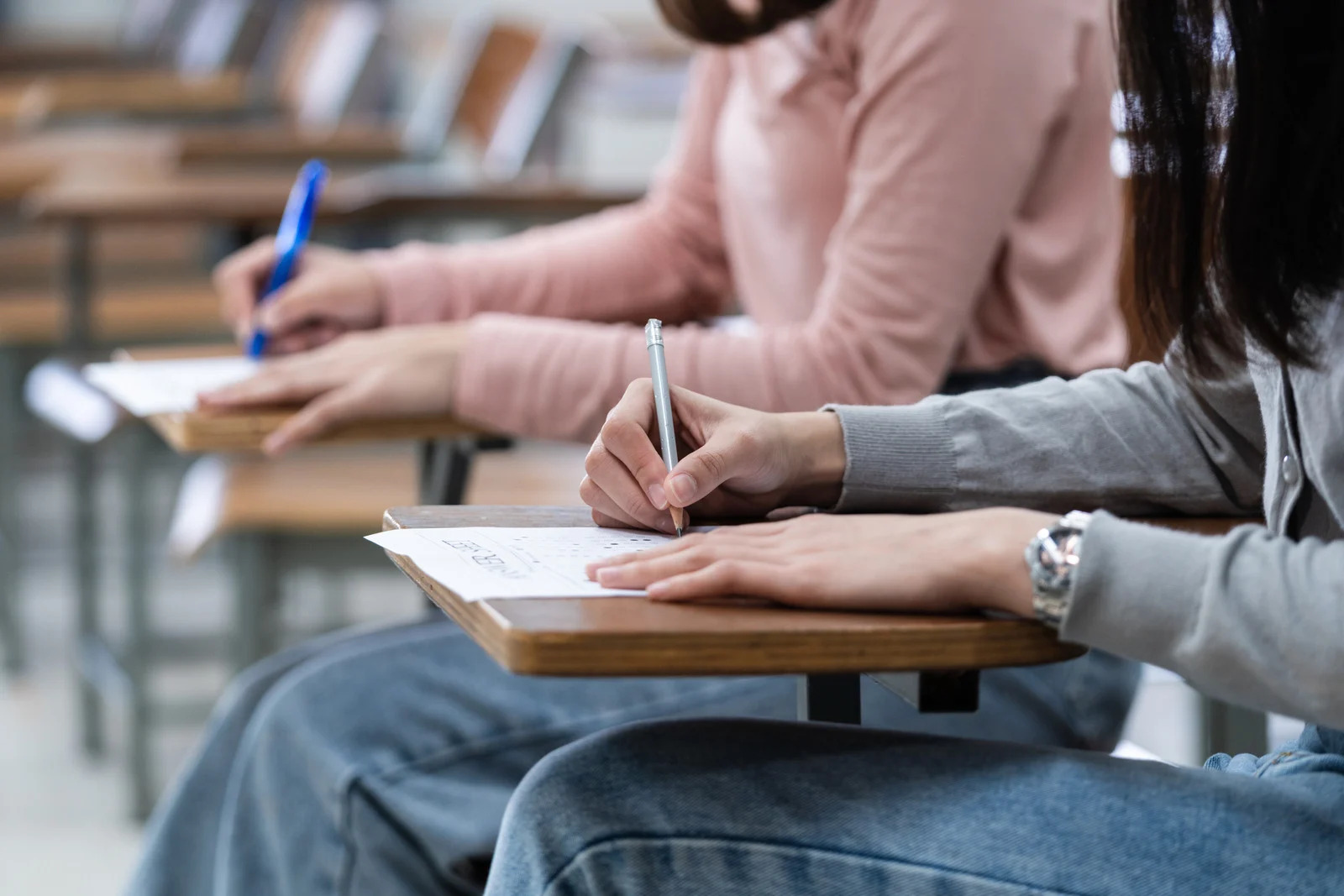 Students writing an exam in a classroom